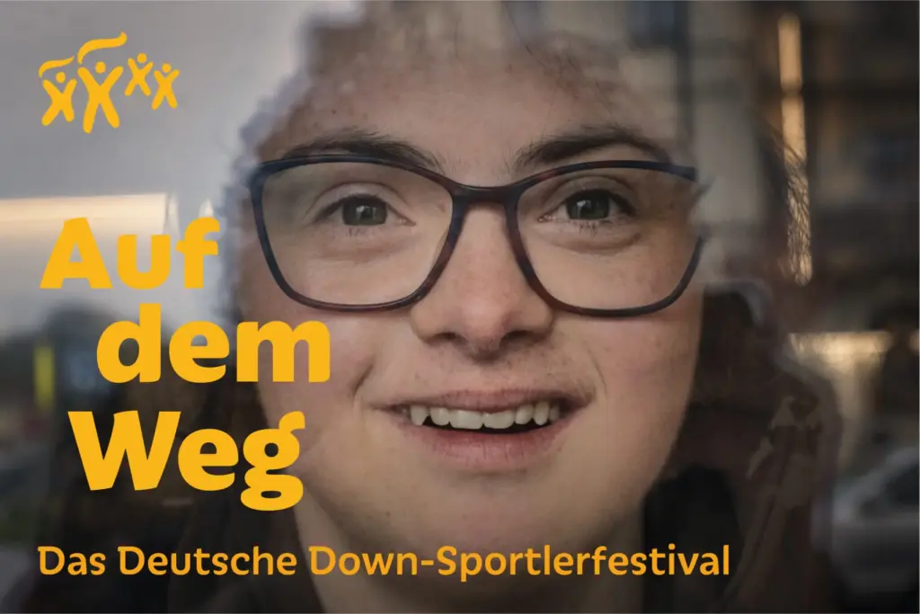 A child with big black-rimmed glasses is looking through a window. Yellow text shows the title of the exhibition.
